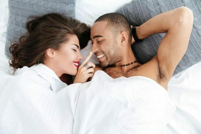Image showing a couple in a bed getting ready for sex